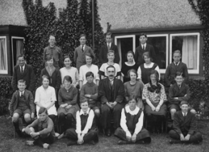 W.T. Higgs, chemistry master, with a group of staff and pupils, c.1920